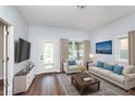 Bright living room with hardwood floors and fireplace at 906 N Parker Ave, Indianapolis, IN 46201