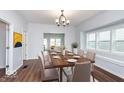 Elegant dining room with hardwood floors and window seat at 906 N Parker Ave, Indianapolis, IN 46201