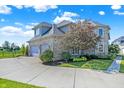 Brick house with a large yard and a circular driveway at 2929 Post Oak Ct, Westfield, IN 46074