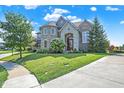 Brick house with a large yard and a circular driveway at 2929 Post Oak Ct, Westfield, IN 46074