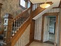 Grand staircase with ornate woodwork at 202 N State St, Greenfield, IN 46140