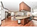 Kitchen with granite counter, wood cabinets, and hardwood floors at 350 N Meridian St # A301, Indianapolis, IN 46204