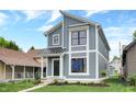 Modern two-story home with gray siding and metal roof at 220 Sanders St, Indianapolis, IN 46225