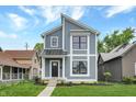 Modern two-story home with gray siding and metal roof at 220 Sanders St, Indianapolis, IN 46225
