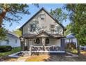 Renovated two-story house with gray and beige siding at 618 N Gladstone Ave, Indianapolis, IN 46201