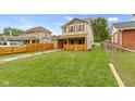 House's exterior showcasing a side yard with a wooden fence at 4513 Norwaldo Ave, Indianapolis, IN 46205