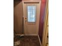 White door with a lace curtain and tiled floor at 14 Winchester Ct, Anderson, IN 46013