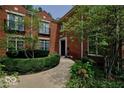 Brick home with landscaped walkway and lush greenery at 6470 Meridian Pkwy # Apt D, Indianapolis, IN 46220