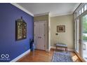 Bright entryway with hardwood floors and unique decor at 6470 Meridian Pkwy # Apt D, Indianapolis, IN 46220