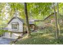 Beautiful home nestled in a wooded setting with brick and siding at 6235 Johnson Rd, Indianapolis, IN 46220