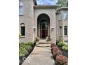 Grand entryway with brick facade and double doors at 5300 W Autumn Springs Ct, Muncie, IN 47304