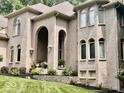 Large brick house with landscaped yard and entryway at 5300 W Autumn Springs Ct, Muncie, IN 47304
