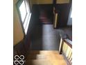 Wooden staircase with dark wood paneling at 3358 Ruckle St, Indianapolis, IN 46205