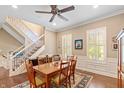 Spacious dining room with hardwood floors and a view of the kitchen at 2495 Glebe St, Carmel, IN 46032