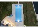 An elevated view of a pristine rectangular pool, surrounded by a spacious patio at 5181 S Poplar Dr, Columbus, IN 47201