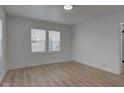 Bright living room with hardwood floors and neutral walls at 1517 Wallace Ave, Indianapolis, IN 46201