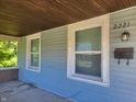 House exterior featuring a light blue porch at 2221 Langley Ave, Indianapolis, IN 46218