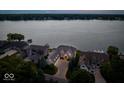 Luxury lakefront home with a large driveway at 9088 Nautical Watch Dr, Indianapolis, IN 46236