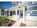 Two-story home with a covered porch and brick entryway at 1678 Orchard Dr, Fortville, IN 46040