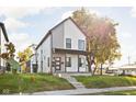 Two-story modern home with gray and white siding, front porch, and landscaped lawn at 1643 Sheldon St, Indianapolis, IN 46218