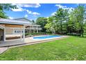 Rectangular in-ground pool with a large patio at 2150 Washington St, Columbus, IN 47201