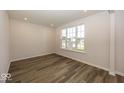 Spacious office with large window and wood-look flooring at 9317 Coopers Ln, McCordsville, IN 46055