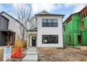 New construction home with white siding and a gray door at 1647 Sheldon St, Indianapolis, IN 46218