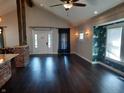 Spacious living area with dark hardwood floors and exposed beams at 1344 Barth Ave, Indianapolis, IN 46203