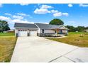 Newly constructed home with a large driveway and attached two-car garage at 10614 N 300 E, Morristown, IN 46161