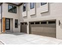 Two-car garage with brown doors and black hardware at 441 W 86Th St, Indianapolis, IN 46260