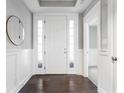 Bright entryway with hardwood floors and white wainscoting at 437 W 86Th St, Indianapolis, IN 46260