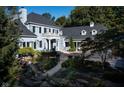 Luxury home with a large backyard, landscaping, and a courtyard at 8358 Hidden Point Dr, Indianapolis, IN 46256