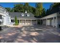 Spacious three-car garage with covered parking and brick pavers at 8358 Hidden Point Dr, Indianapolis, IN 46256