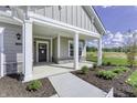 Covered front porch with stone and white columns at 11419 Neptune Dr, Fishers, IN 46040