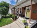 Inviting front porch with seating and decorative planters at 32 E Caven St, Indianapolis, IN 46225