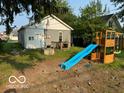 Backyard with a playset and a small deck at 1202 S Shipley St, Muncie, IN 47302