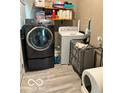 Laundry room with washer, dryer and shelving at 1202 S Shipley St, Muncie, IN 47302