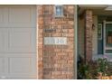 The house number 1936 is displayed on a brick at 1936 Broadmoor Ln, Columbus, IN 47203