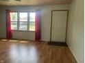 Living room with hardwood floors and large windows at 2416 Radcliffe Ave, Indianapolis, IN 46227