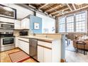 Modern kitchen with stainless steel appliances and light wood cabinets at 735 Lexington Ave # Apt 8, Indianapolis, IN 46203