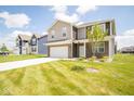 Two story home with brick and siding exterior at 91 Booth St, Whiteland, IN 46184