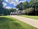 Two-story home with a three car garage and a large yard at 303 Wellington Overlook, Noblesville, IN 46060
