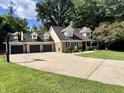 Two-story home with a three car garage and a large yard at 303 Wellington Overlook, Noblesville, IN 46060