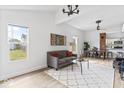 Open concept living area showcasing a gray sofa and views of the kitchen and backyard at 1046 Dawson St, Indianapolis, IN 46203