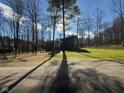 Modern home nestled in a wooded lot with a long driveway and manicured lawn at 3380 N Pine Song Dr, Martinsville, IN 46151