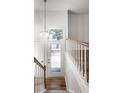 Bright entryway with hardwood floors and staircase at 571 Lockerbie S Cir, Indianapolis, IN 46202
