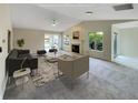 Spacious living room featuring a fireplace and access to a sunroom at 8124 Farmhurst Ln, Indianapolis, IN 46236