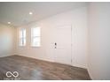 Bright living room with hardwood floors and neutral walls at 6289 Rhinecliff Dr, Whitestown, IN 46075