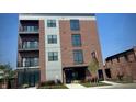Modern apartment building with brick and gray siding at 150 S Main St # 201, Franklin, IN 46131
