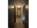 Long hallway with gray walls and light wood flooring at 9145 Shenandoah Dr, Indianapolis, IN 46229